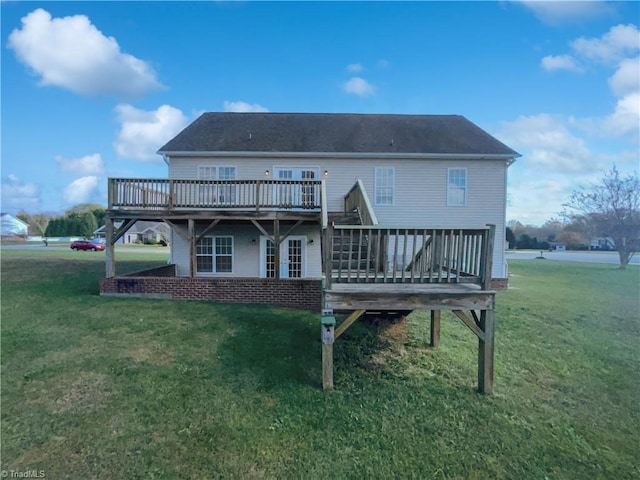 back of house featuring a yard and a deck