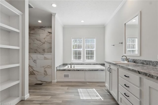 2875 Motsinger Rd, Winston-Salem, NC 27107 - full bathroom with crown molding, a garden tub, vanity, recessed lighting, and a tile shower
