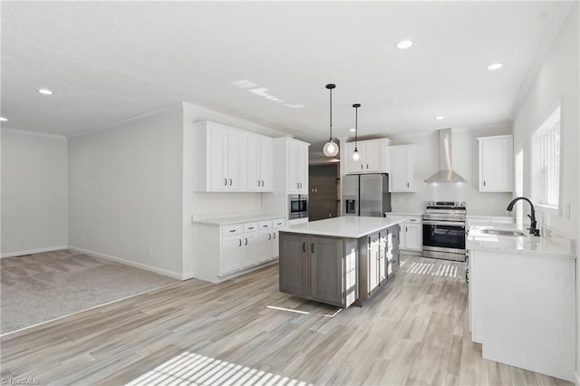 2875 Motsinger Rd, Winston-Salem, NC 27107 - kitchen with stainless steel appliances, wall chimney range hood, recessed lighting, white cabinetry, and ornamental molding