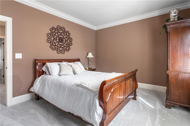 carpeted bedroom featuring baseboards and ornamental molding