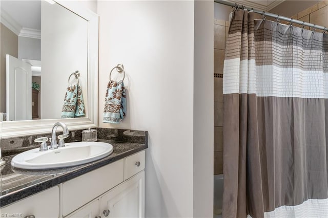 full bathroom with vanity and ornamental molding