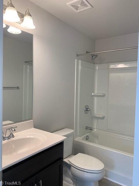 full bathroom with vanity, toilet, and shower / bathtub combination