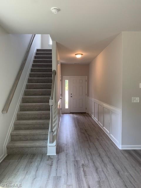 foyer entrance featuring wood-type flooring