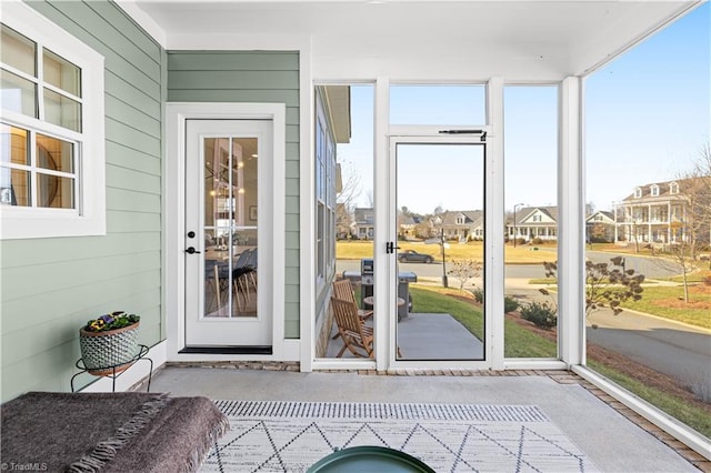 exterior space with french doors and a residential view