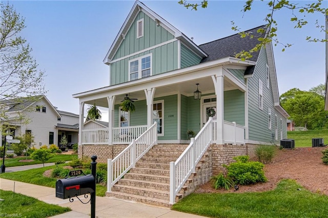 view of front of property featuring board and batten siding, a porch, a ceiling fan, and central AC unit