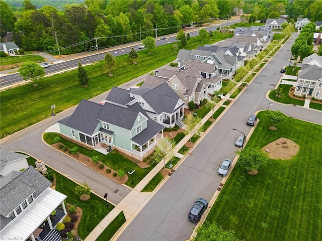 birds eye view of property with a residential view