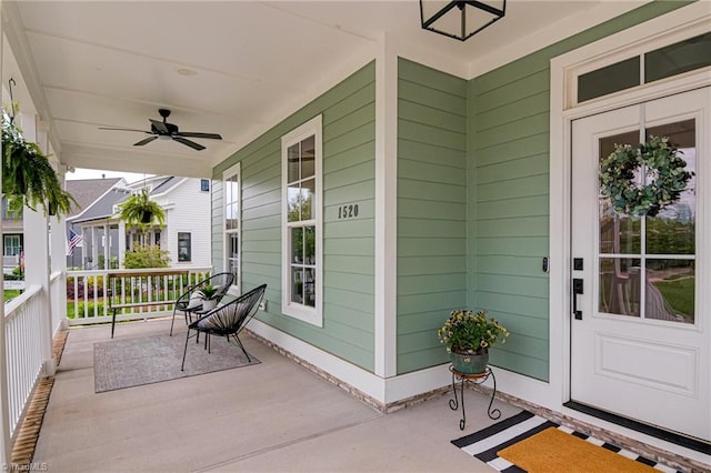 exterior space with a ceiling fan and a porch