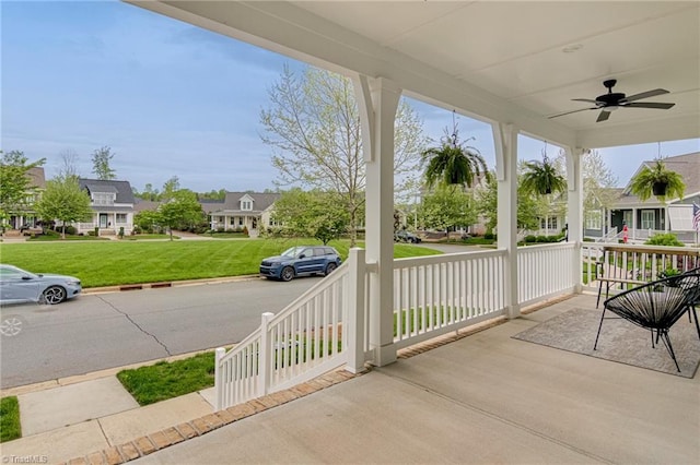 view of patio featuring a residential view, ceiling fan, and covered porch