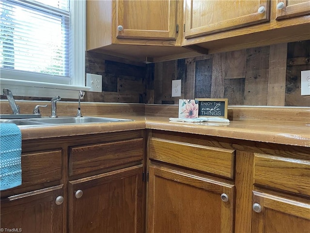 kitchen featuring sink and backsplash