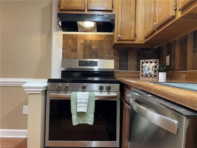 kitchen with range hood and stainless steel appliances