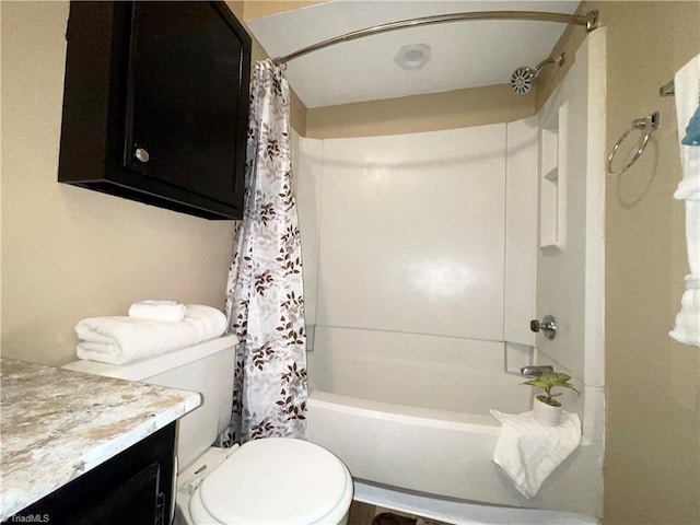 full bathroom with vanity, shower / bath combination with curtain, and toilet