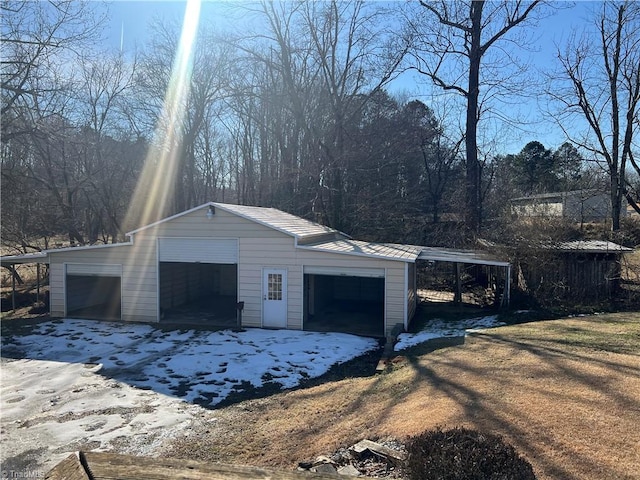 garage featuring a carport