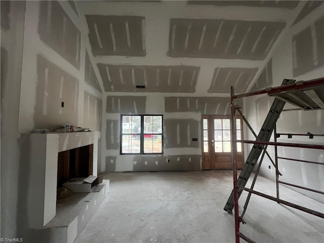 unfurnished bedroom with concrete floors