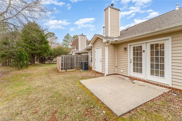 view of yard with a patio, cooling unit, and fence