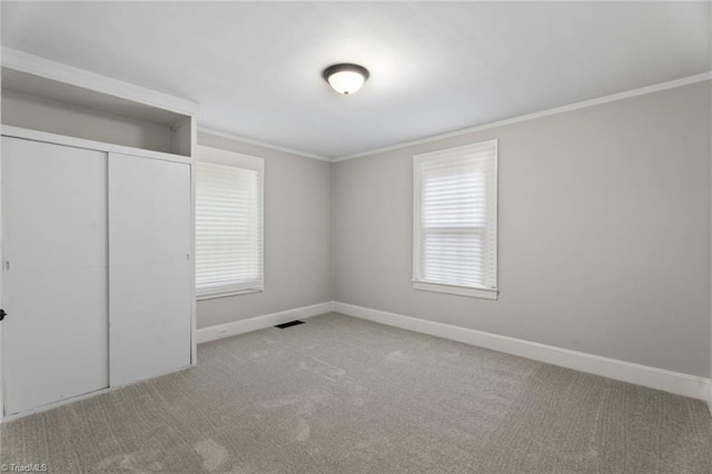 2505 Druid Hills Dr, Winston-Salem, NC 27105 - unfurnished bedroom with crown molding, carpet, and a closet