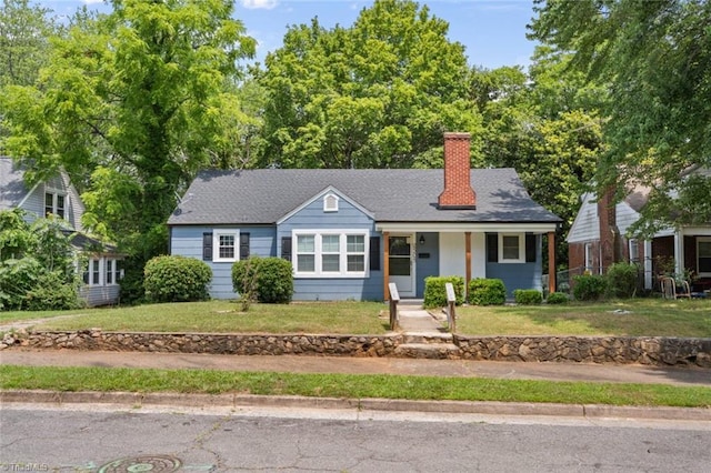 2505 Druid Hills Dr, Winston-Salem, NC 27105 - view of front of house featuring a chimney, covered porch, and a front yard