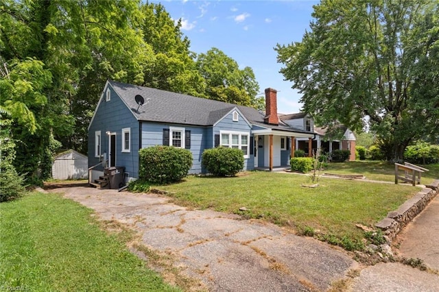 2505 Druid Hills Dr, Winston-Salem, NC 27105 - view of front facade with a chimney, a front lawn, and an outbuilding