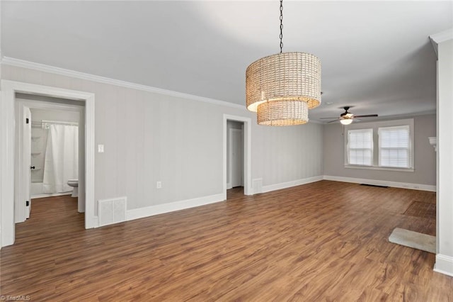 2505 Druid Hills Dr, Winston-Salem, NC 27105 - unfurnished room with a chandelier, crown molding, wood finished floors, and ceiling fan