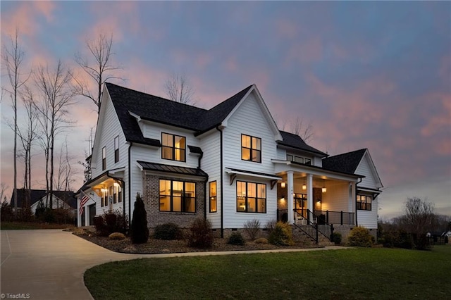 view of front of property with crawl space, covered porch, concrete driveway, and a front lawn