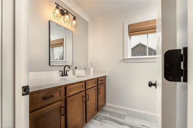 bathroom with vanity and baseboards