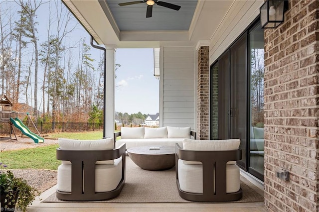 view of patio / terrace featuring an outdoor hangout area, a playground, ceiling fan, and fence