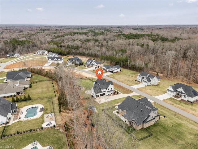 aerial view with a forest view and a residential view