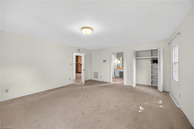 1409 Coventry Rd, High Point, NC 27262 - unfurnished bedroom with carpet flooring, connected bathroom, and a closet