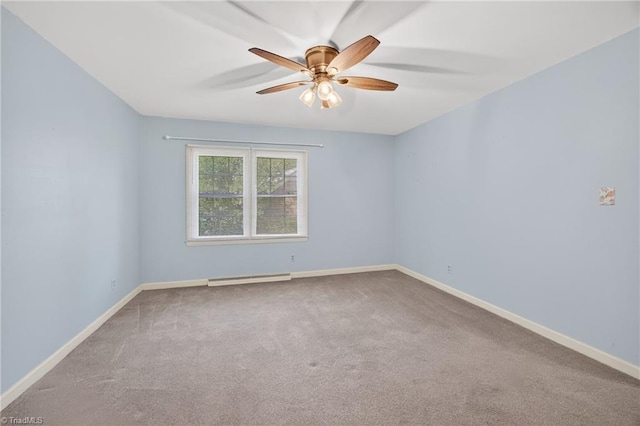 1409 Coventry Rd, High Point, NC 27262 - carpeted empty room featuring a ceiling fan and a baseboard radiator