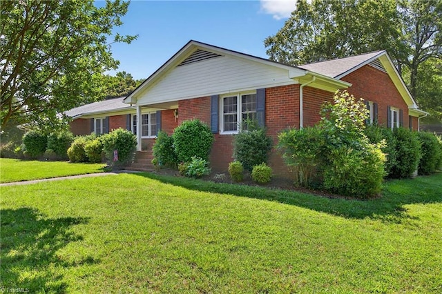 1409 Coventry Rd, High Point, NC 27262 - ranch-style house featuring brick siding and a front yard