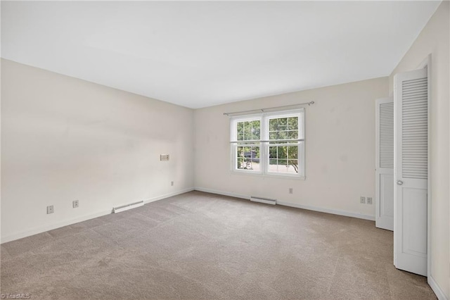 1409 Coventry Rd, High Point, NC 27262 - unfurnished bedroom featuring carpet and a baseboard heating unit