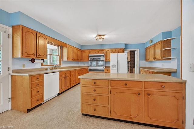 1409 Coventry Rd, High Point, NC 27262 - kitchen featuring white appliances, open shelves, light countertops, and brown cabinets