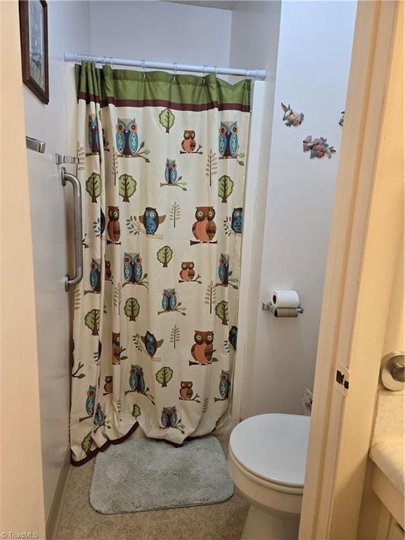2205 Sunderland Rd Unit 107D, Winston-Salem, NC 27103 - bathroom with toilet and a shower with shower curtain