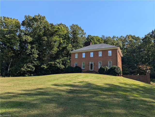 view of side of home featuring a yard