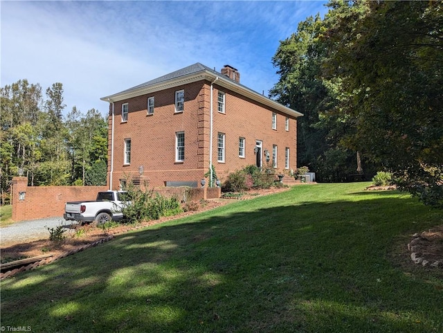 view of home's exterior with a yard