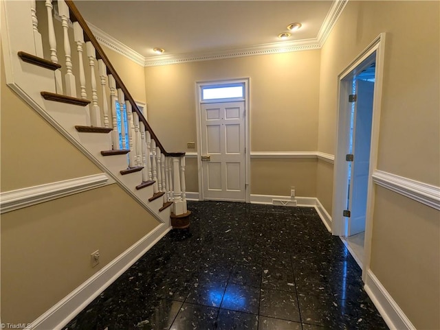 foyer with crown molding and tile patterned flooring