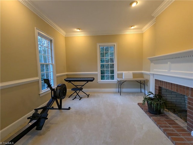 exercise room featuring ornamental molding, carpet flooring, and a fireplace