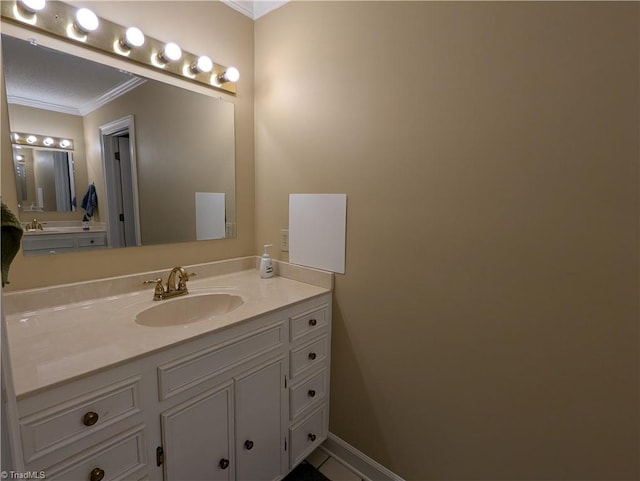 bathroom with vanity and crown molding