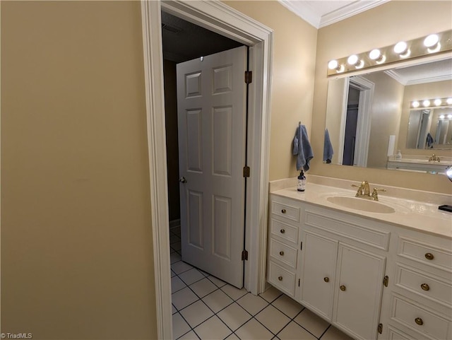 bathroom featuring vanity, crown molding, and tile patterned flooring