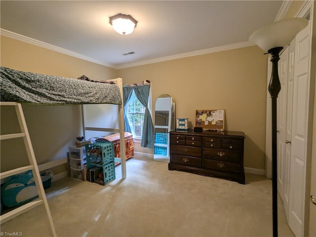 bedroom with ornamental molding and light carpet