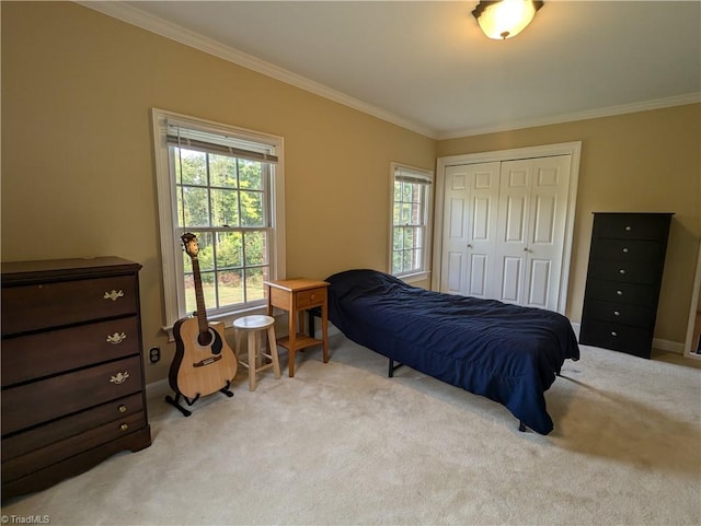 carpeted bedroom with multiple windows, ornamental molding, and a closet