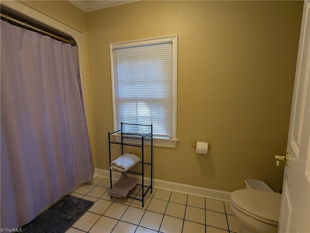 bathroom with toilet, ornamental molding, a shower with shower curtain, and tile patterned flooring