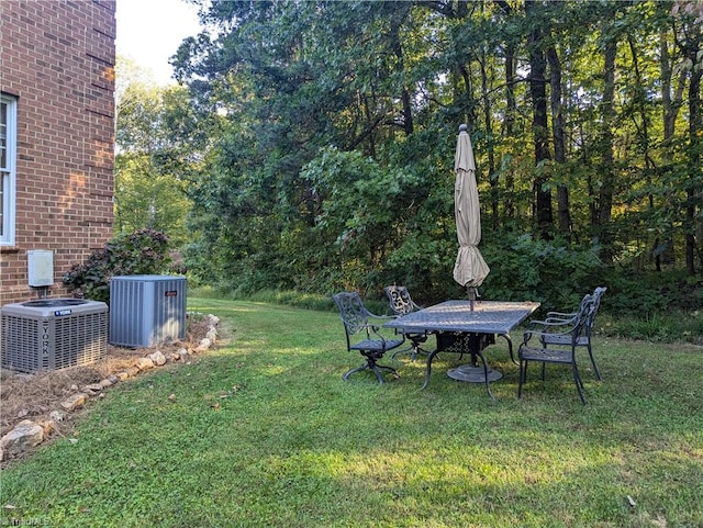 view of yard featuring central air condition unit