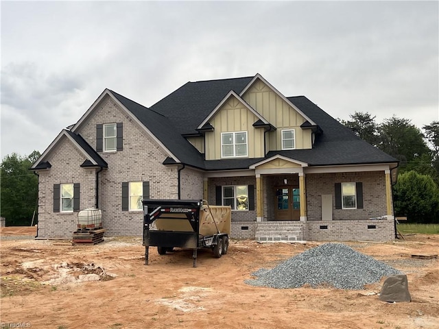 8301 Hunters Dr, Greensboro, NC 27455 - craftsman house featuring board and batten siding, brick siding, and crawl space