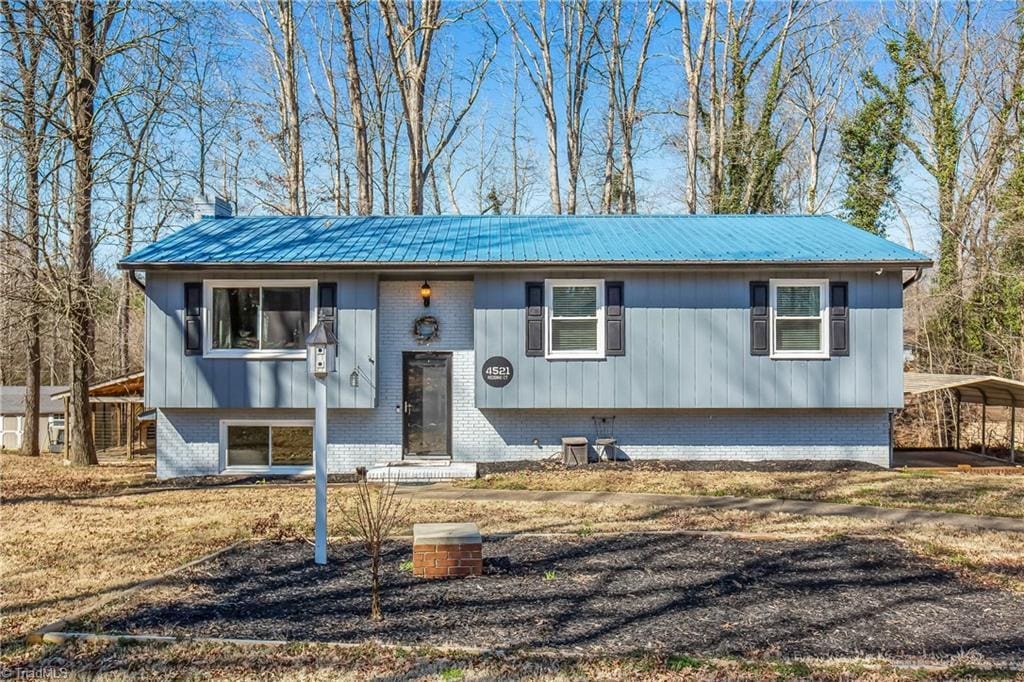 4521 Redding Ct, Trinity, NC 27370 - raised ranch with metal roof, a carport, and brick siding