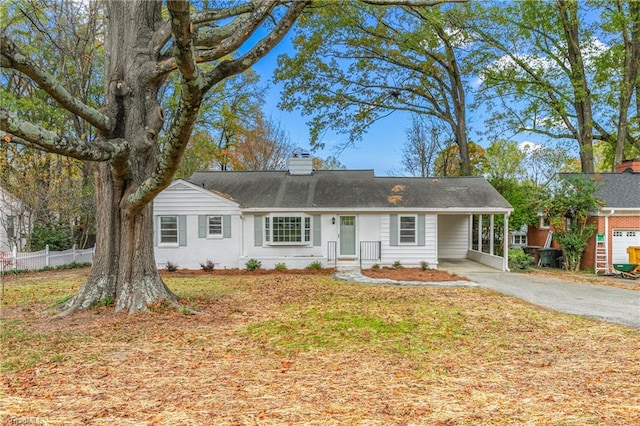 ranch-style house featuring a carport