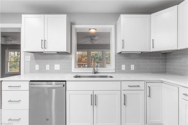 kitchen featuring dishwasher, white cabinets, a wealth of natural light, and sink