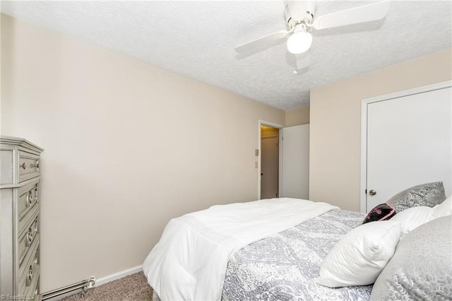 carpeted bedroom featuring ceiling fan, a textured ceiling, and baseboards