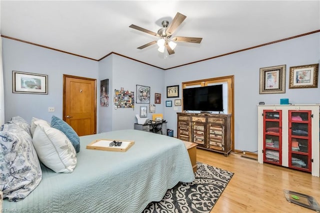 bedroom with a ceiling fan, light wood-style floors, and ornamental molding