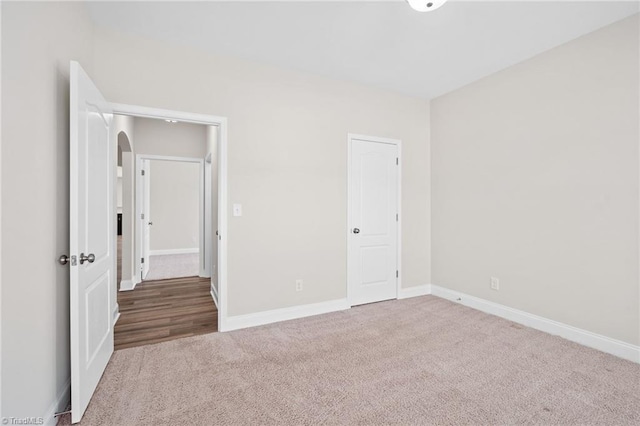 unfurnished bedroom with carpet and a closet