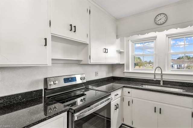 kitchen featuring sink, white cabinetry, dark stone countertops, and electric stove